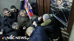 Serbia election protesters try to storm capital’s city hall