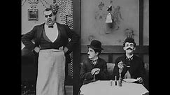 Usa - 1917 - in this silent comedy, a man (charlie chaplin) frustrates a waiter by wearing his hat at the table.
