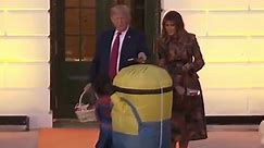 Donald Trump puts Halloween sweets on head of child dressed as minion in resurfaced clip