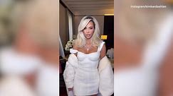 Kim Kardashian is heavenly in white mini dress & matching coat