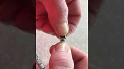 How to add a Nomination charm to a bracelet. Good luck!