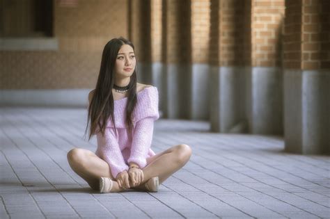 sitting women asian model brunette looking away on