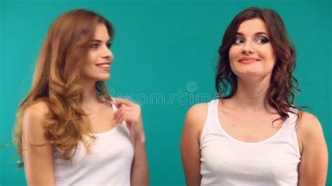Two Girls Girlfriend Smiling Talking Green Background Stock Footage