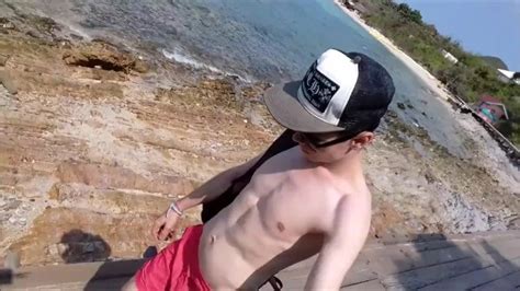 russian teen walks on the beach and shows his cock in