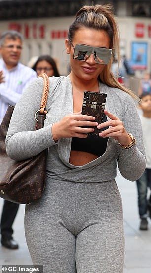 lauren goodger shows off her incredible curves in grey jumpsuit daily