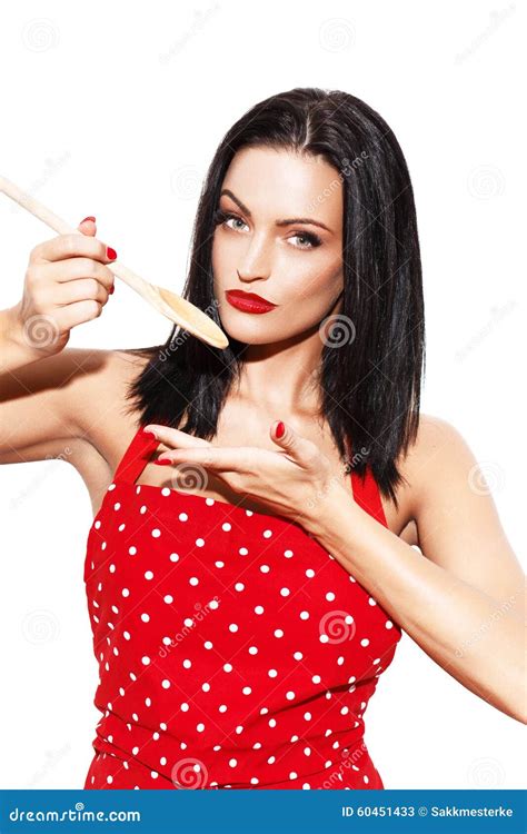 Sexy Housewife Cook In Red Dotted Apron Holding Kitchen Spoon Stock