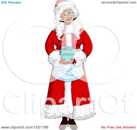 clipart of a happy christmas mrs claus holding a t royalty free