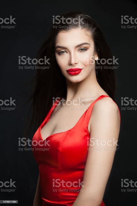 Young Perfect Brunette Woman With Red Lips Makeup And Dark Hair On