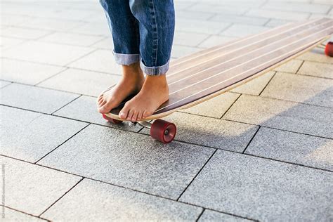 closeup   barefoot girl skateboarding   longboard   street  bonninstudio girl