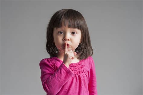 Girl Making A Keep Quiet Gesture Stock Image Image Of Multiracial
