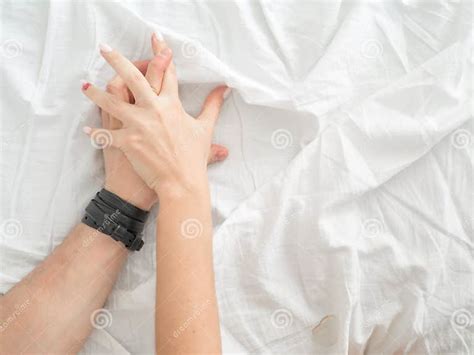 Close Up Hands Of A Couple Make Love Hot Sex On A Bed Stock Image