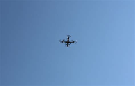 droneflyingwithblueskybackdrop