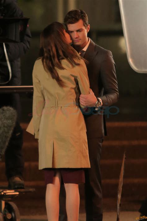 sam and aaron taylor johnson kiss on the set of fifty shades of grey and dakota johnson kisses