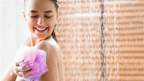 Premium Photo Woman Rubbing Body With Foam Enjoying Refreshing Shower