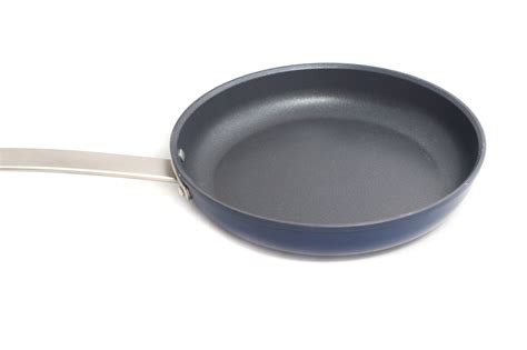 clean  stick frying pan isolated  white  stock image