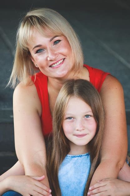 premium photo beautiful blonde mom in a red t shirt with her daughter