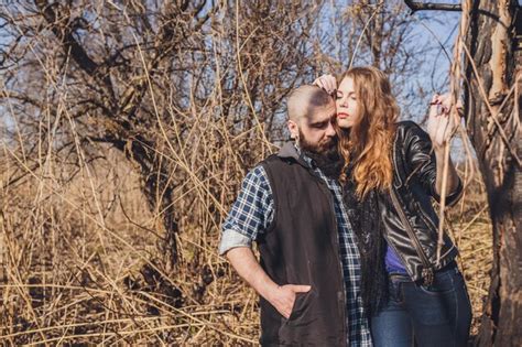 Premium Photo Hipster Couple Girl With Red Hair And Shaved Bearded Man