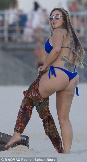 geordie shore s holly hagan uses tanning oil on her bum at sydney s bondi beach daily mail online