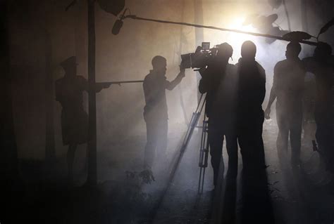 actors perform a scene at night while filming ‘october 1 a police