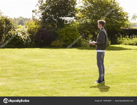 man flying drone quadcopter stock photo  monkeybusiness