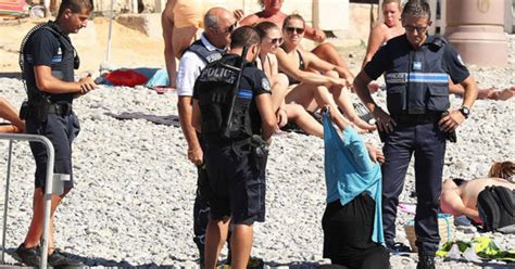 beach goer forced to strip off by armed police as nice launches beach