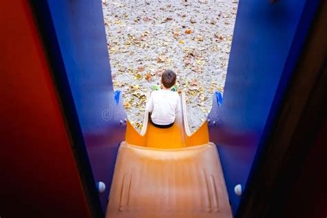 child sliding   sliding board stock photo image  play
