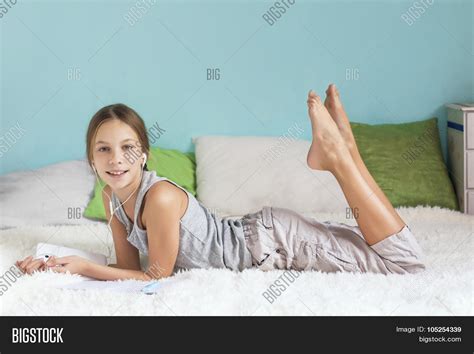 pre teen girl relaxing bed image and photo bigstock