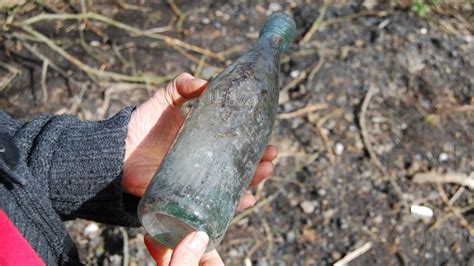 bottle digging in old dumps can yield collectable finds bbc news