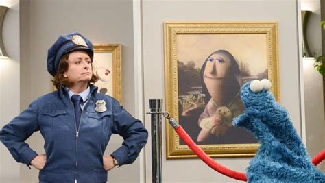 rachel dratch and cookie monster investigate a theft in the pbs special