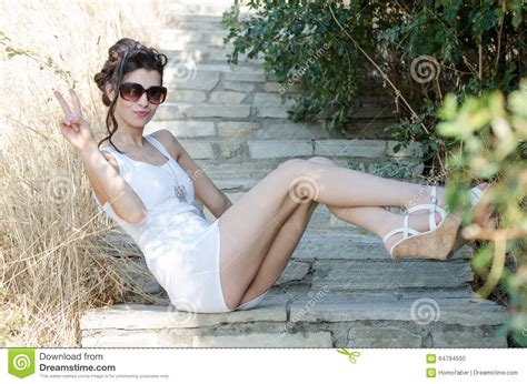Slim Lady Wear Tight Short White Dress And Sunglasses