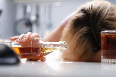 Premium Photo Drunk Woman Sleeping At The Table A Bottle Of Alcohol