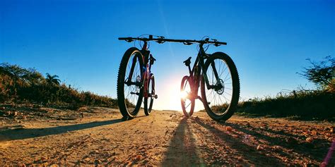 images land vehicle road bicycle mountain bike sky mountainous landforms tree path