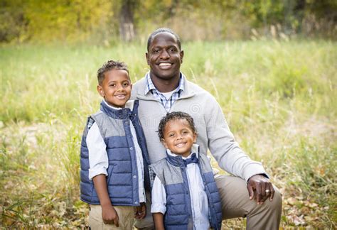 outdoor portrait of a racially diverse father with his two sons stock image image of group
