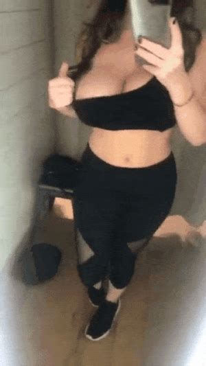 brunette bouncing nude average boobs is undressing selfie