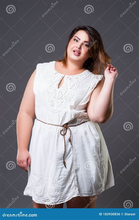 plus size fashion model in casual clothes fat woman on gray background