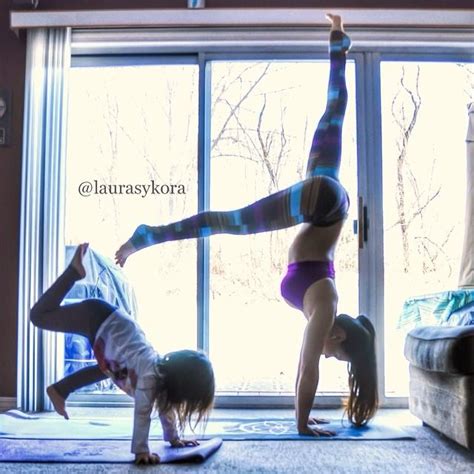 mother and 4 year old daughter take adorable pictures of their impressive yoga poses