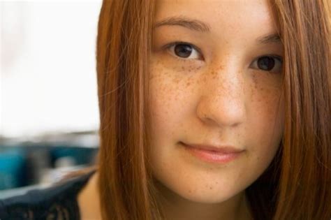 a freckled redhead of east asian ethnicity beautiful