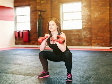 Take Your Kettlebell Squats To The Next Level With This Small Tweak