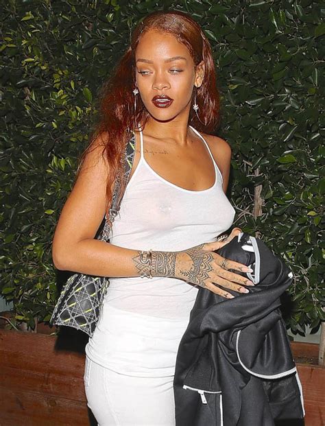 rihanna exposes pierced nipple by going braless after