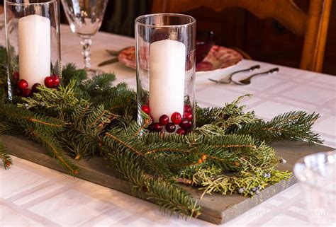 wood candle cranberry and fresh evergreen centerpiece
