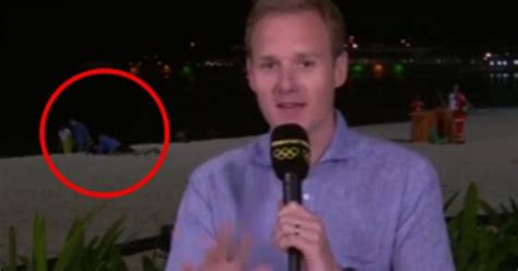 watch bbc news reporter is interrupted by couple having sex on the beach in rio