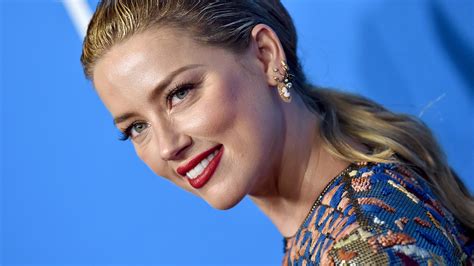 amber heard reacts to wardrobe malfunction in braless outfit stylecaster