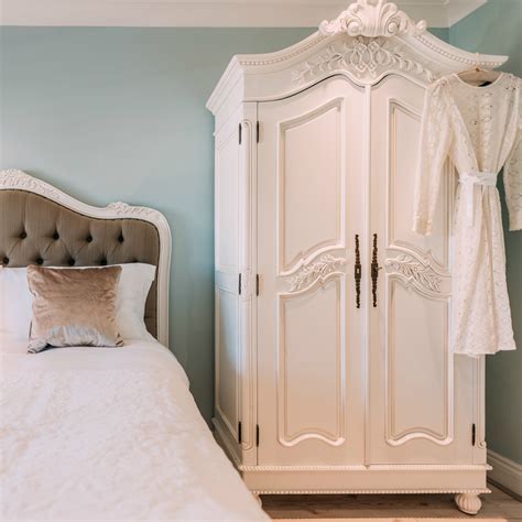 french white hand carved double armoire wardrobe furniture la maison chic luxury interiors