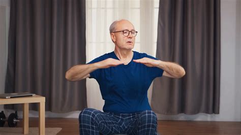 elderly man exercising  living room sitting  stability ball