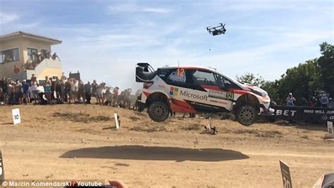 drone gets hit by rally car flying over a dip and crashes