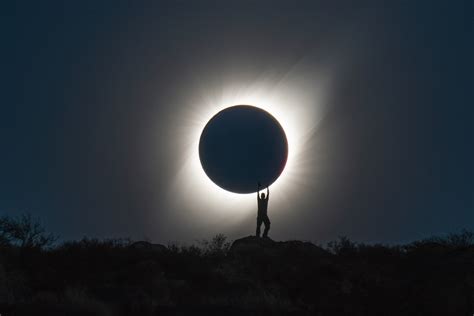photographer captures perfect shot  person holding  total solar