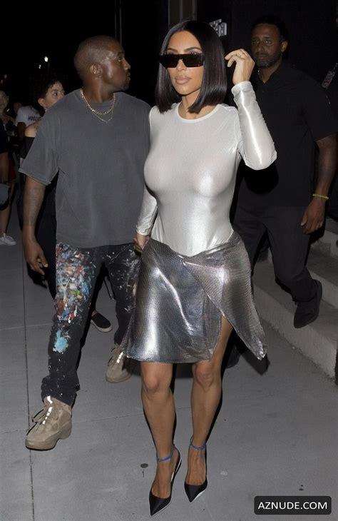 kim kardashian braless in a very candid outfit with husband kanye west