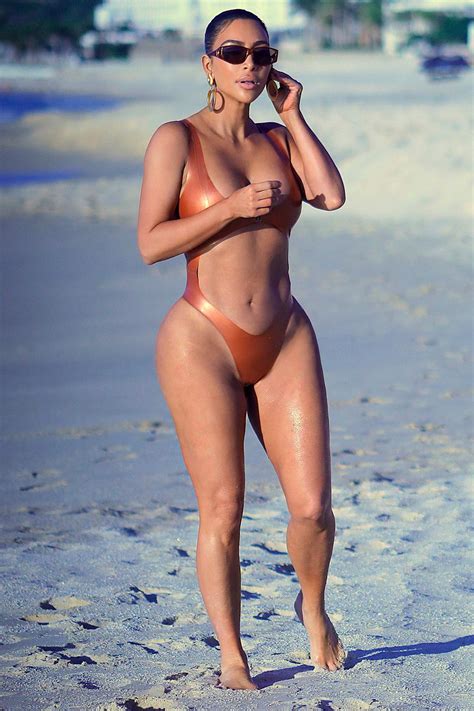 kim kardashian stuns in an orange bikini as she hits the