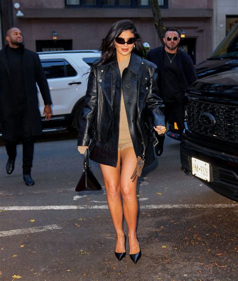 Kylie Jenner Goes Pantsless As She Covers Up In Only A Black Mini