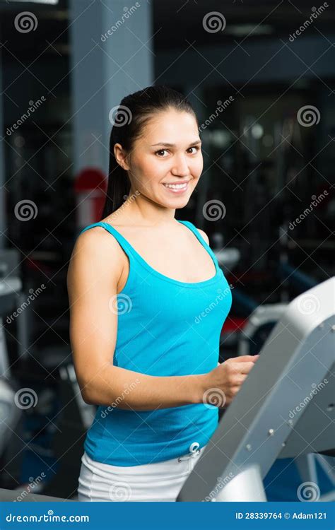 attractive young woman runs   treadmill stock photo image  adult beautiful